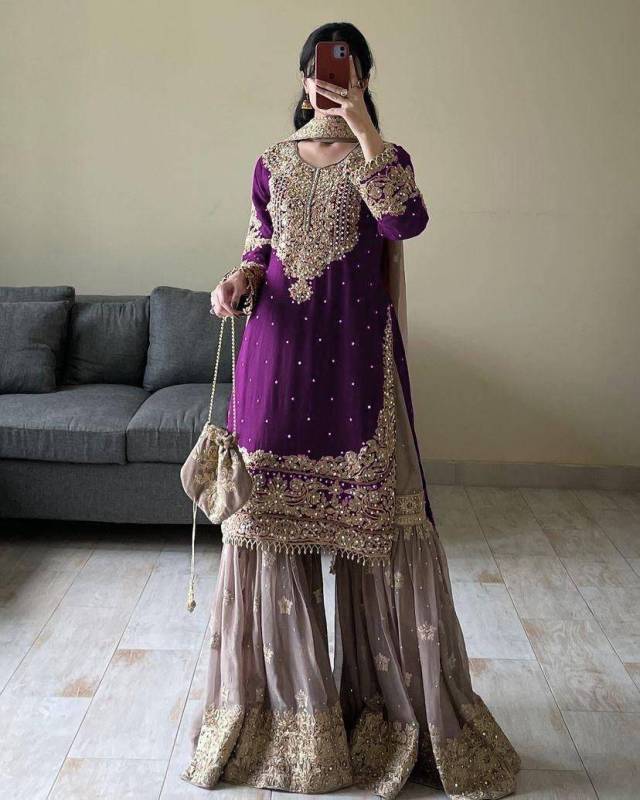 Faux Georgette sharara palazzo set features a top with real mirror and coding sequence embroidery.